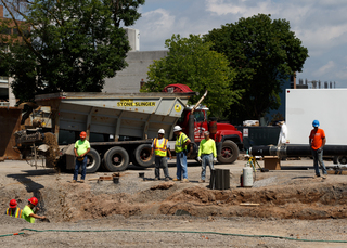 Gravel is being tossed into a trench as work continues on the sewer line upgrade project on Waverly Avenue. Photo taken July 18, 2017